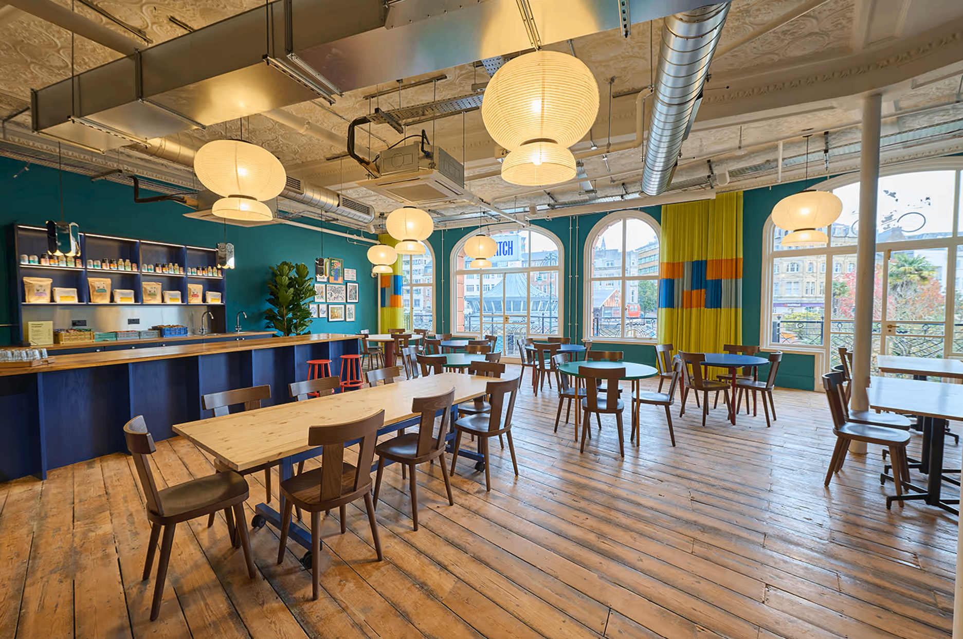 The PATCH first-floor space at Bobby's & Co, Bournemouth — open plan with bar, big windows and wooden floors
